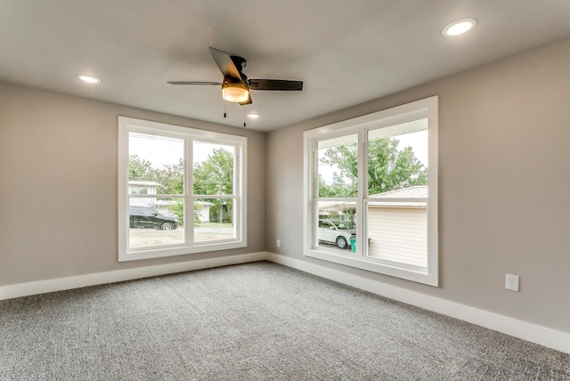 unfurnished room with carpet and ceiling fan