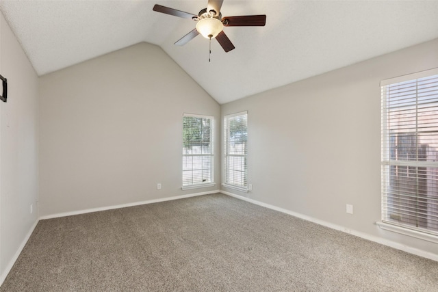 unfurnished room with carpet, vaulted ceiling, and ceiling fan