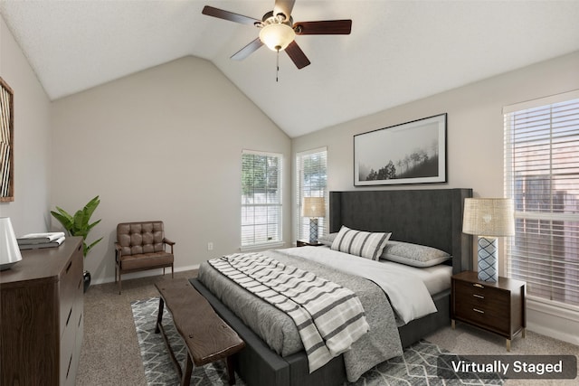 carpeted bedroom featuring vaulted ceiling and ceiling fan