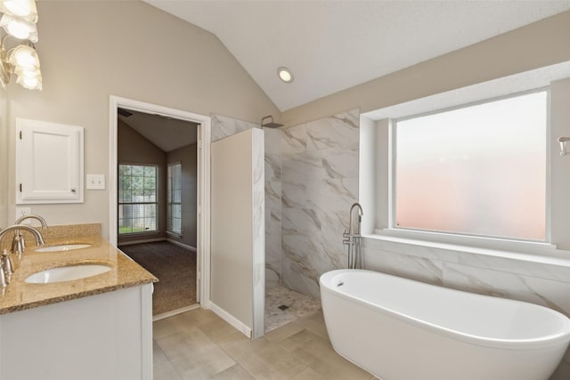 bathroom featuring tile patterned floors, vanity, vaulted ceiling, and shower with separate bathtub