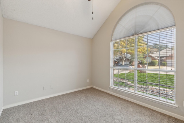 unfurnished room with carpet floors and vaulted ceiling