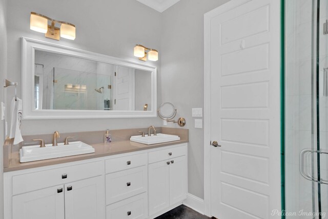 bathroom with vanity, toilet, and ornamental molding