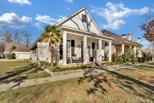 view of front of home featuring a porch and a front lawn