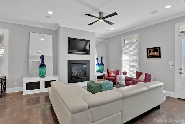 living room with ceiling fan and crown molding