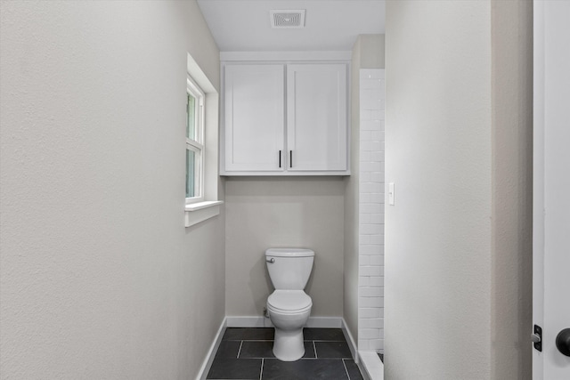 bathroom featuring tile patterned floors and toilet