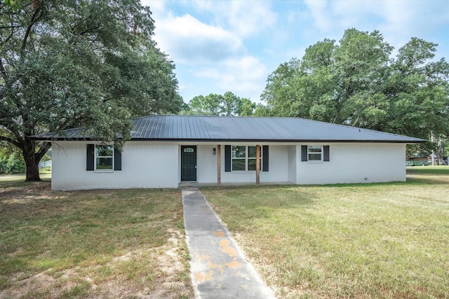 ranch-style house with a porch and a front lawn