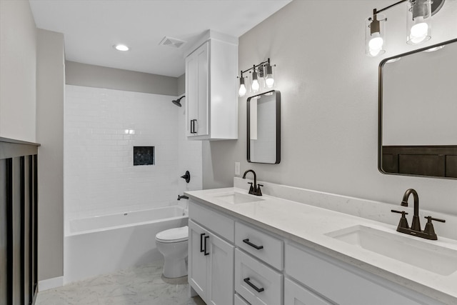 full bathroom with vanity, toilet, and tiled shower / bath