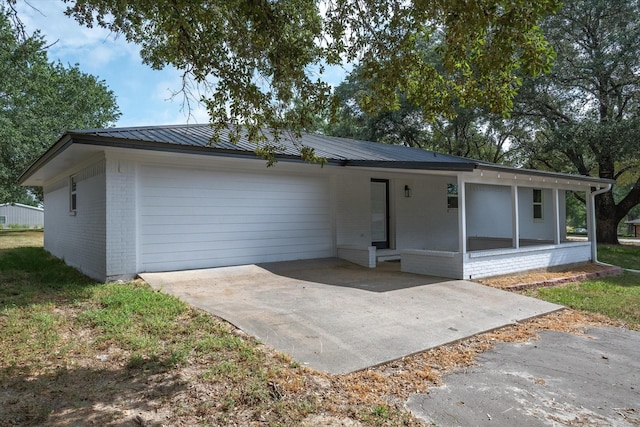 ranch-style house featuring a carport