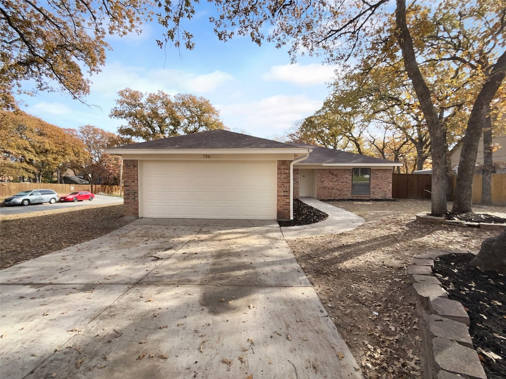 view of side of property with a garage