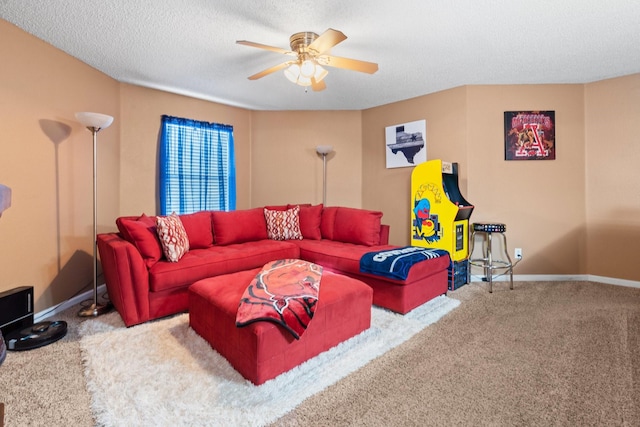 carpeted living area with ceiling fan, a textured ceiling, and baseboards