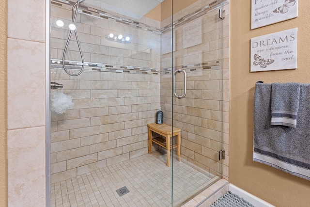 bathroom featuring a stall shower