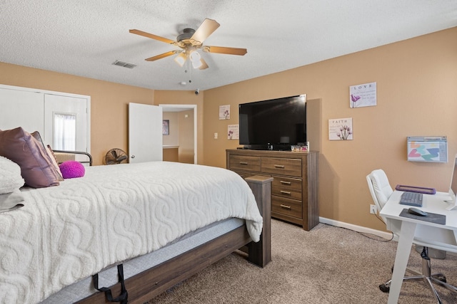 bedroom with a textured ceiling, ceiling fan, light colored carpet, visible vents, and baseboards