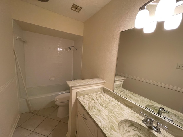 full bathroom featuring tile patterned flooring, vanity, toilet, and tiled shower / bath