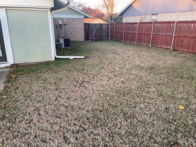 view of yard featuring central air condition unit