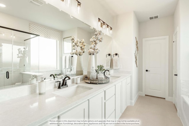 bathroom featuring tile patterned floors, vanity, and separate shower and tub