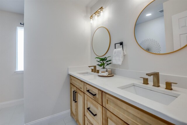 bathroom with an enclosed shower and tile patterned flooring