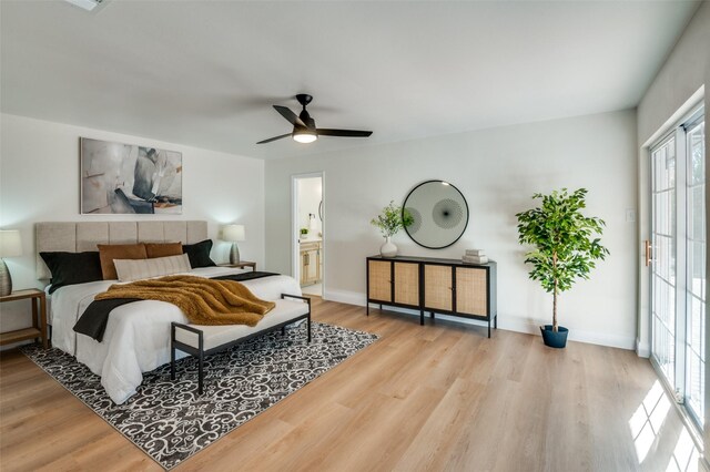 bedroom featuring connected bathroom, ceiling fan, and light hardwood / wood-style flooring