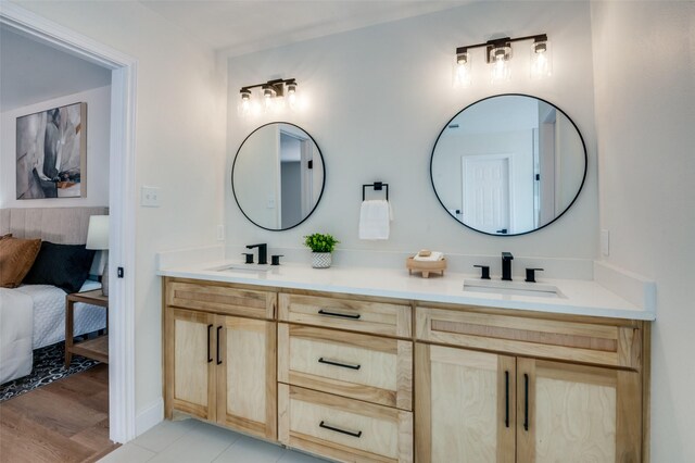 bathroom with tile patterned floors, independent shower and bath, sink, and tile walls