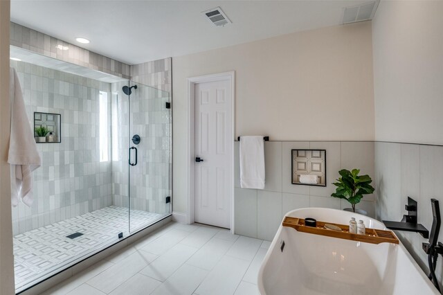 bathroom featuring vanity and a tub to relax in