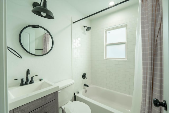 full bathroom with shower / bath combination with curtain, vanity, and toilet