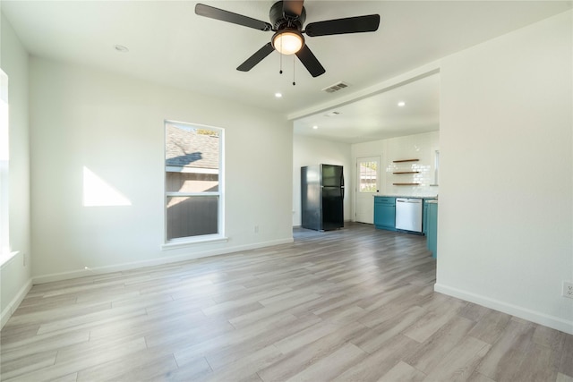 unfurnished living room featuring light hardwood / wood-style flooring, plenty of natural light, and ceiling fan