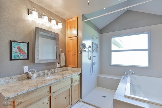 bathroom with tile patterned flooring, vanity, plus walk in shower, and vaulted ceiling