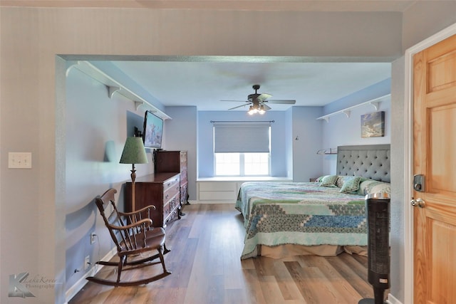 bedroom featuring hardwood / wood-style flooring and ceiling fan