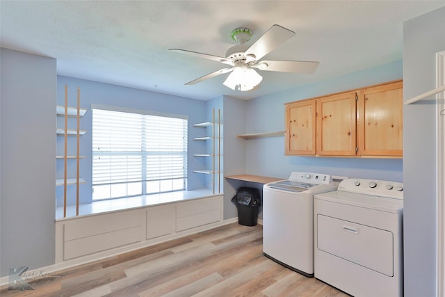 laundry area with washer and clothes dryer, cabinets, ceiling fan, a textured ceiling, and light hardwood / wood-style floors