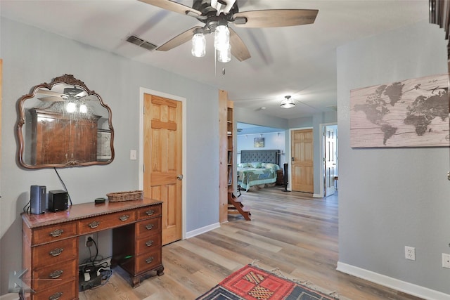 office area featuring ceiling fan and light hardwood / wood-style floors