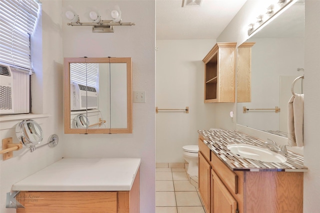 bathroom with tile patterned floors, vanity, cooling unit, and toilet