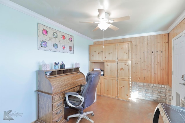 office space featuring wooden walls, ceiling fan, light carpet, and ornamental molding