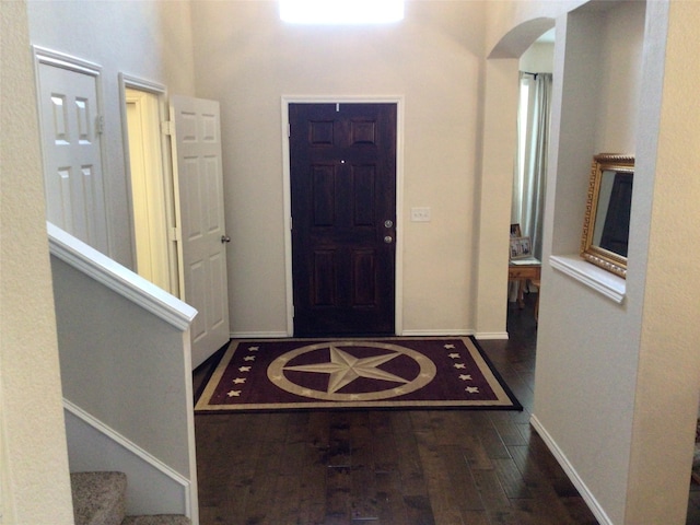 entrance foyer featuring dark wood-type flooring