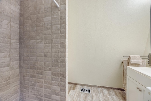 bathroom with vanity and hardwood / wood-style floors