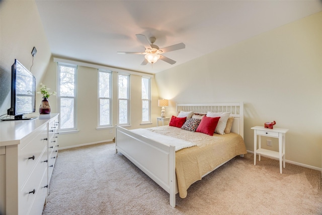 bedroom featuring ceiling fan and light carpet