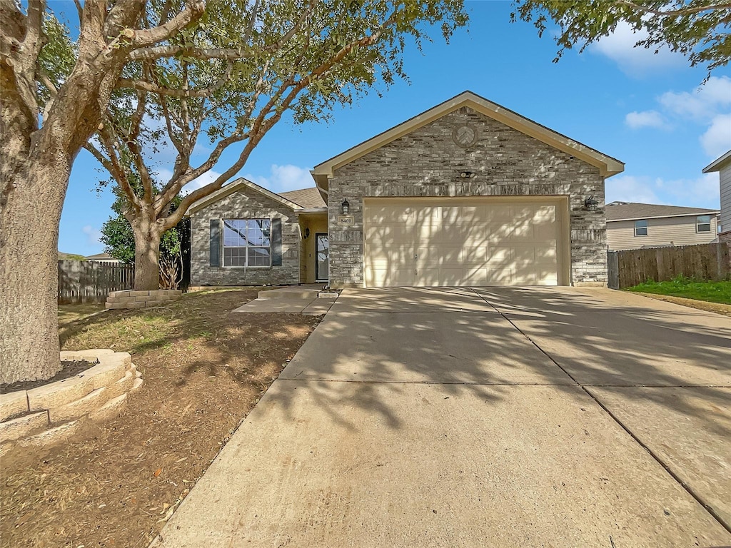 single story home with a garage