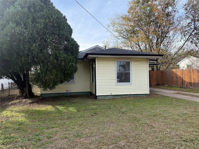 view of property exterior featuring a yard