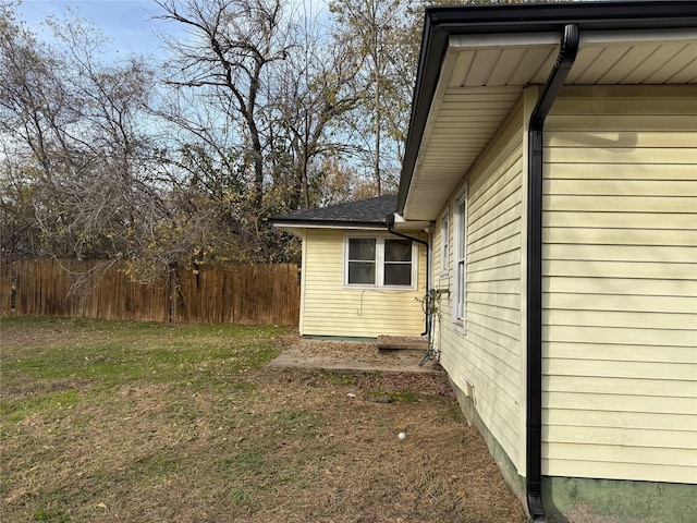 view of side of property featuring a yard