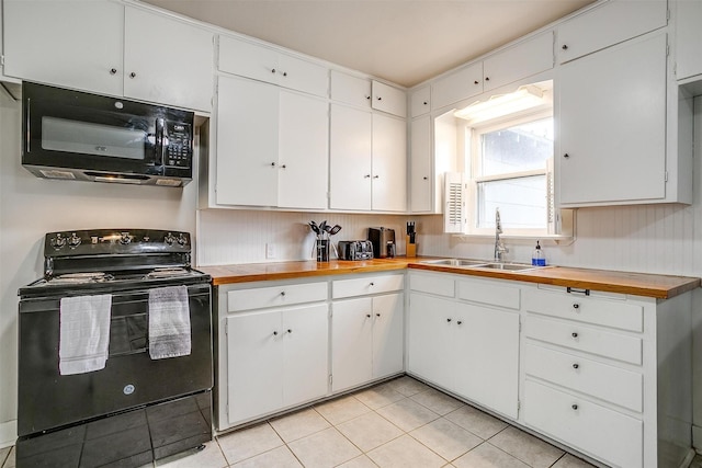 kitchen with white cabinetry and black appliances