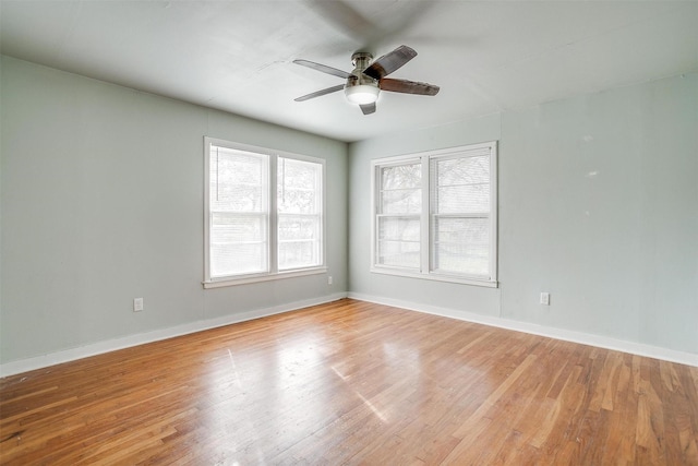 unfurnished room with ceiling fan and light hardwood / wood-style flooring