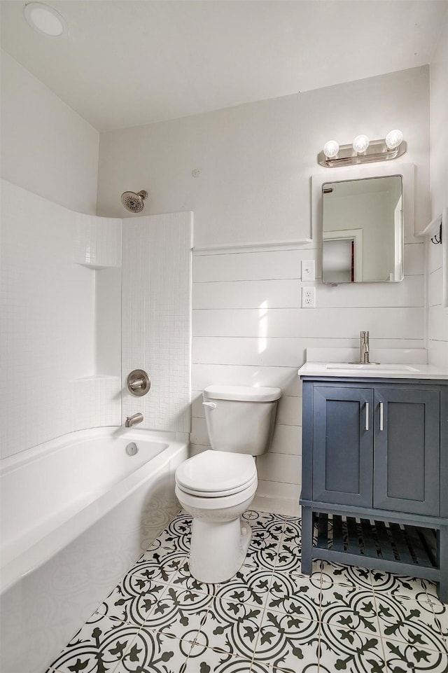 full bathroom with tile patterned flooring, vanity, shower / bathtub combination, and toilet