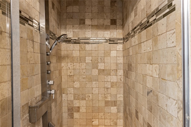 bathroom with a tile shower