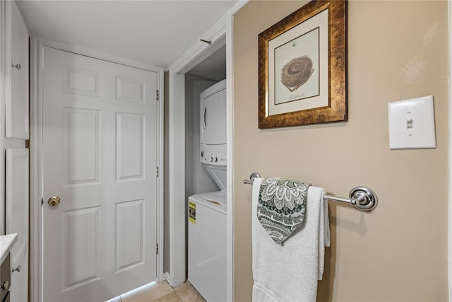 laundry room with stacked washing maching and dryer