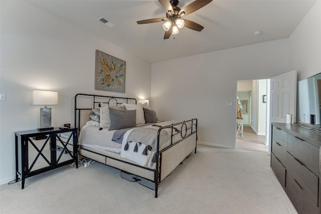 bedroom featuring light colored carpet and ceiling fan