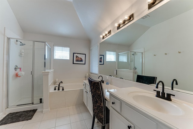 bathroom with tile patterned flooring, shower with separate bathtub, vanity, and lofted ceiling