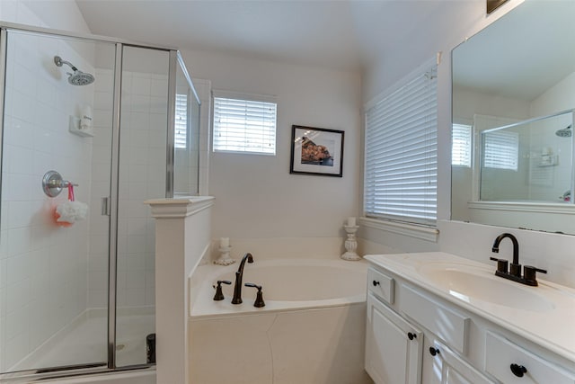 bathroom featuring vanity and plus walk in shower