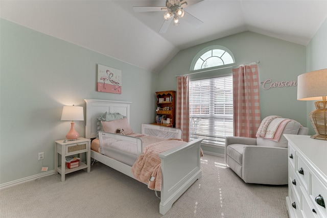 carpeted bedroom with ceiling fan, vaulted ceiling, and multiple windows