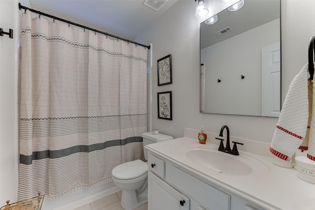 bathroom with toilet, vanity, tile patterned floors, and a shower with shower curtain