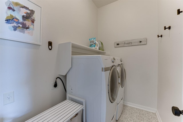 clothes washing area featuring washing machine and dryer