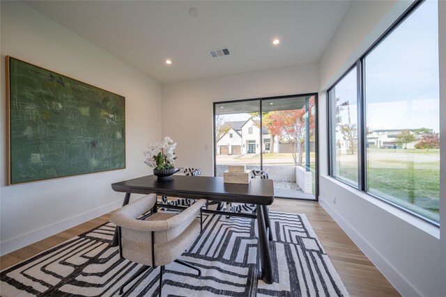 office space with light hardwood / wood-style flooring and a wealth of natural light