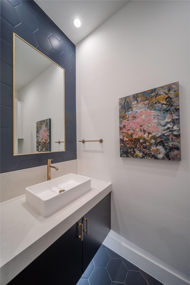 bathroom featuring tile patterned flooring and vanity